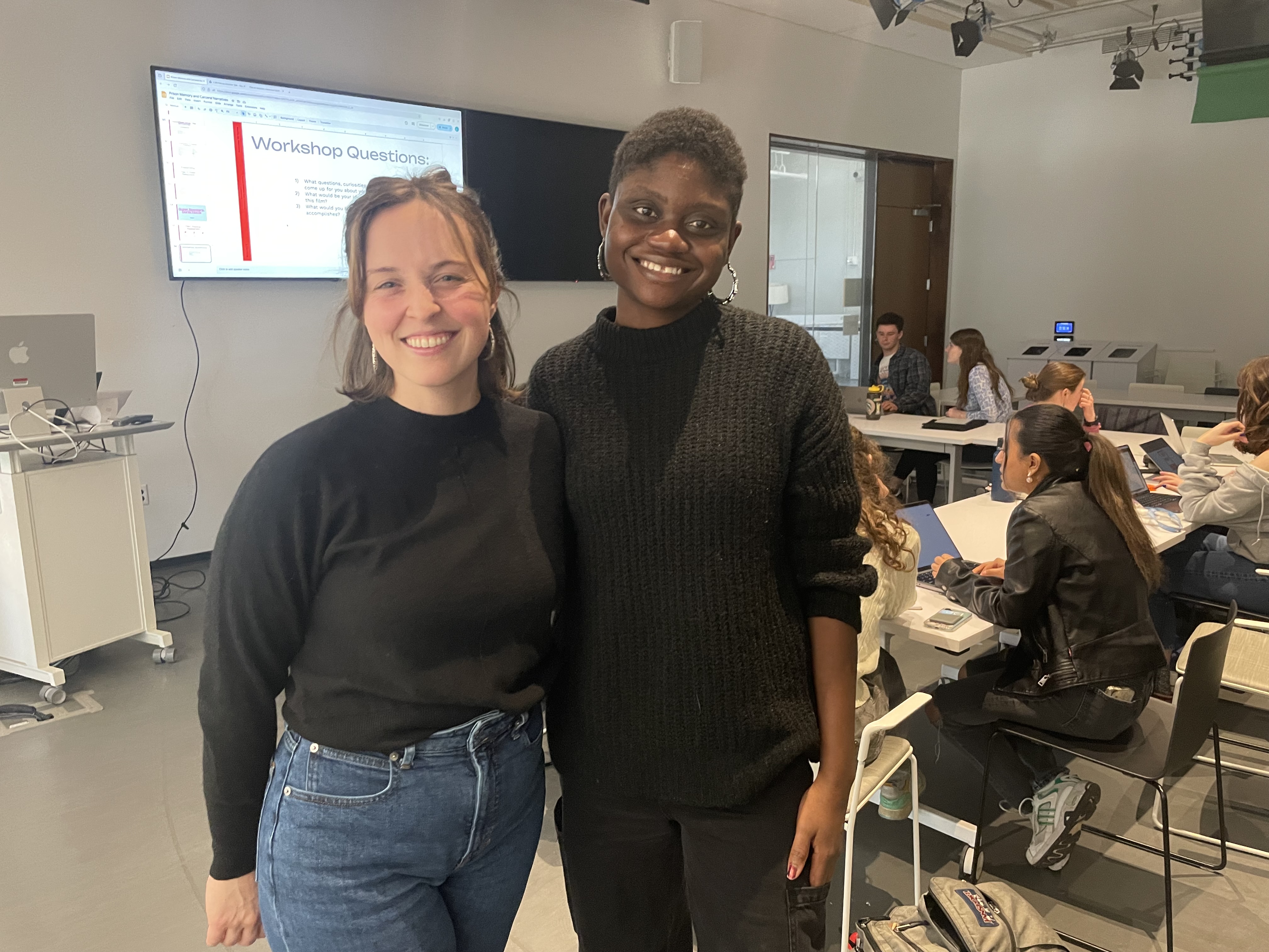 two women pose for a photo together