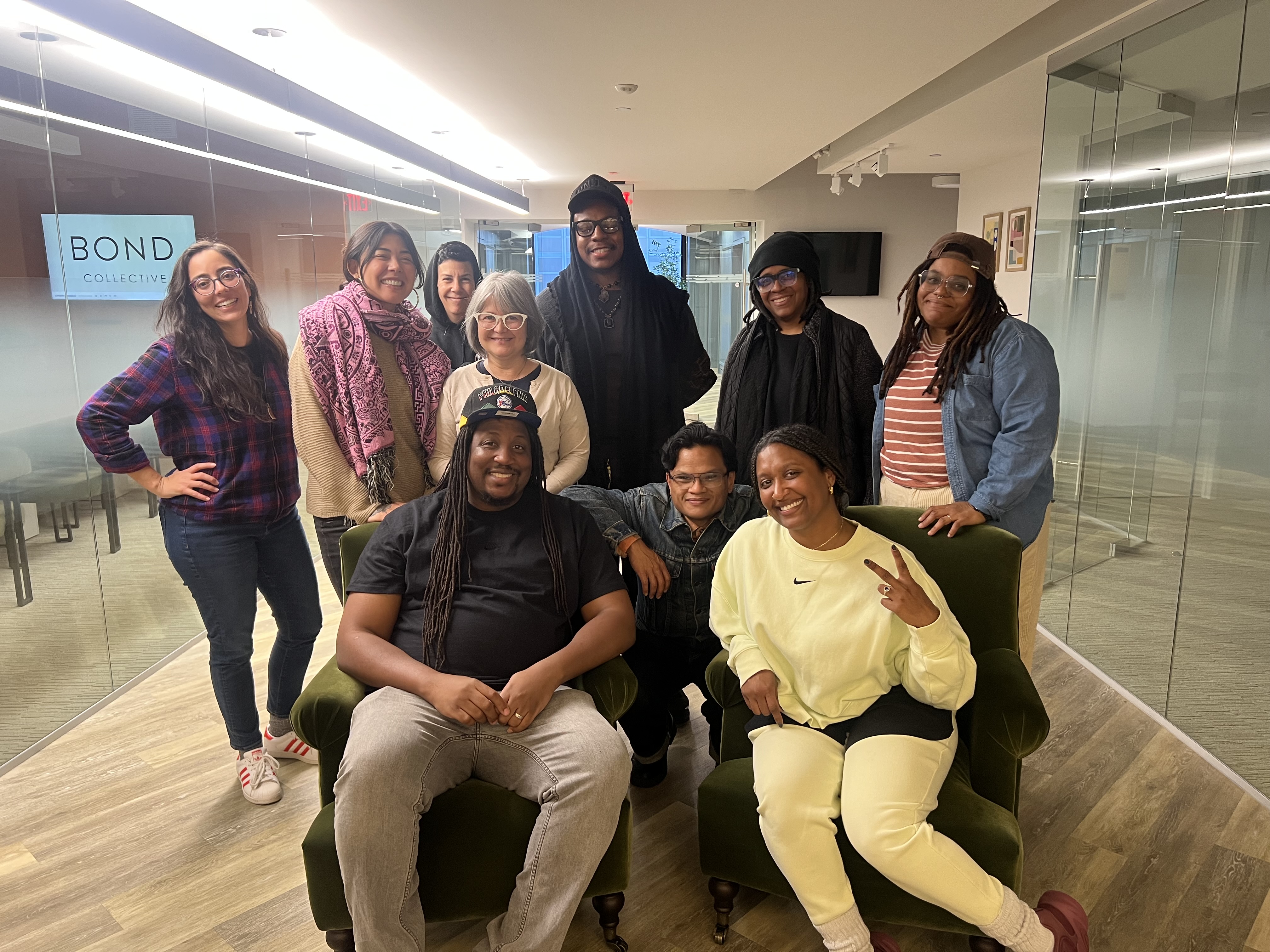 a group of people who participated on a review panel pose for a photo