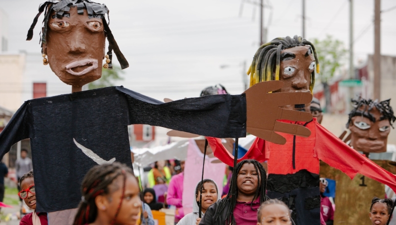 children hold puppets and march at Spiral Q 2024 Blankenburg Parade