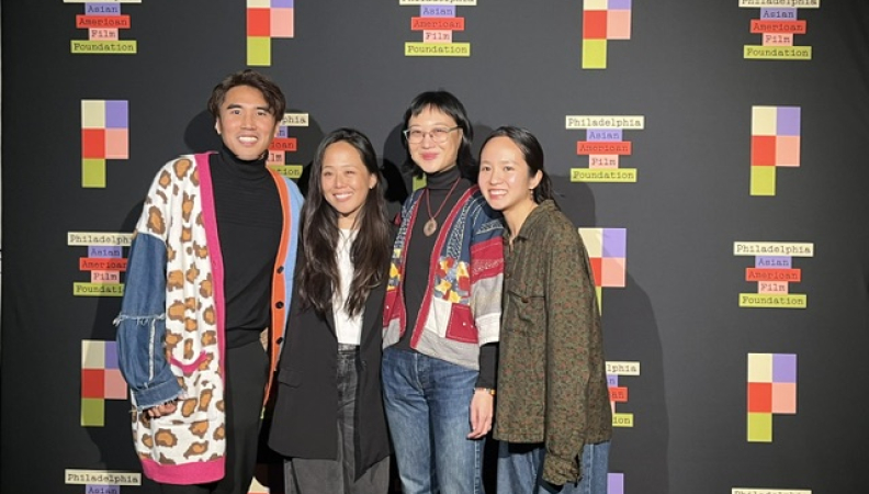 four people pose at a philadelphia asian american film foundation event