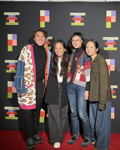four people pose at a philadelphia asian american film foundation event