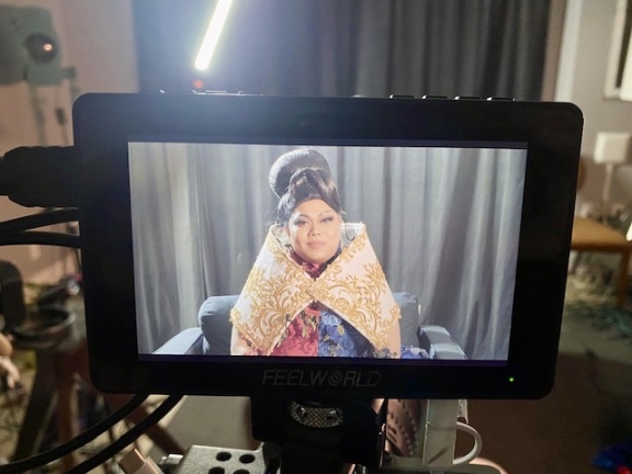 a drag artist featured on a camera screen