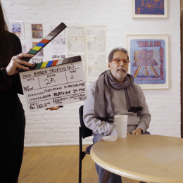 a still from behind-the-scenes of a film titled barrio television